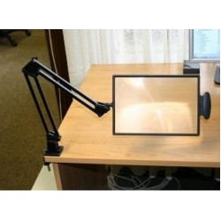 Table-top magnifier mounted on the tabletop